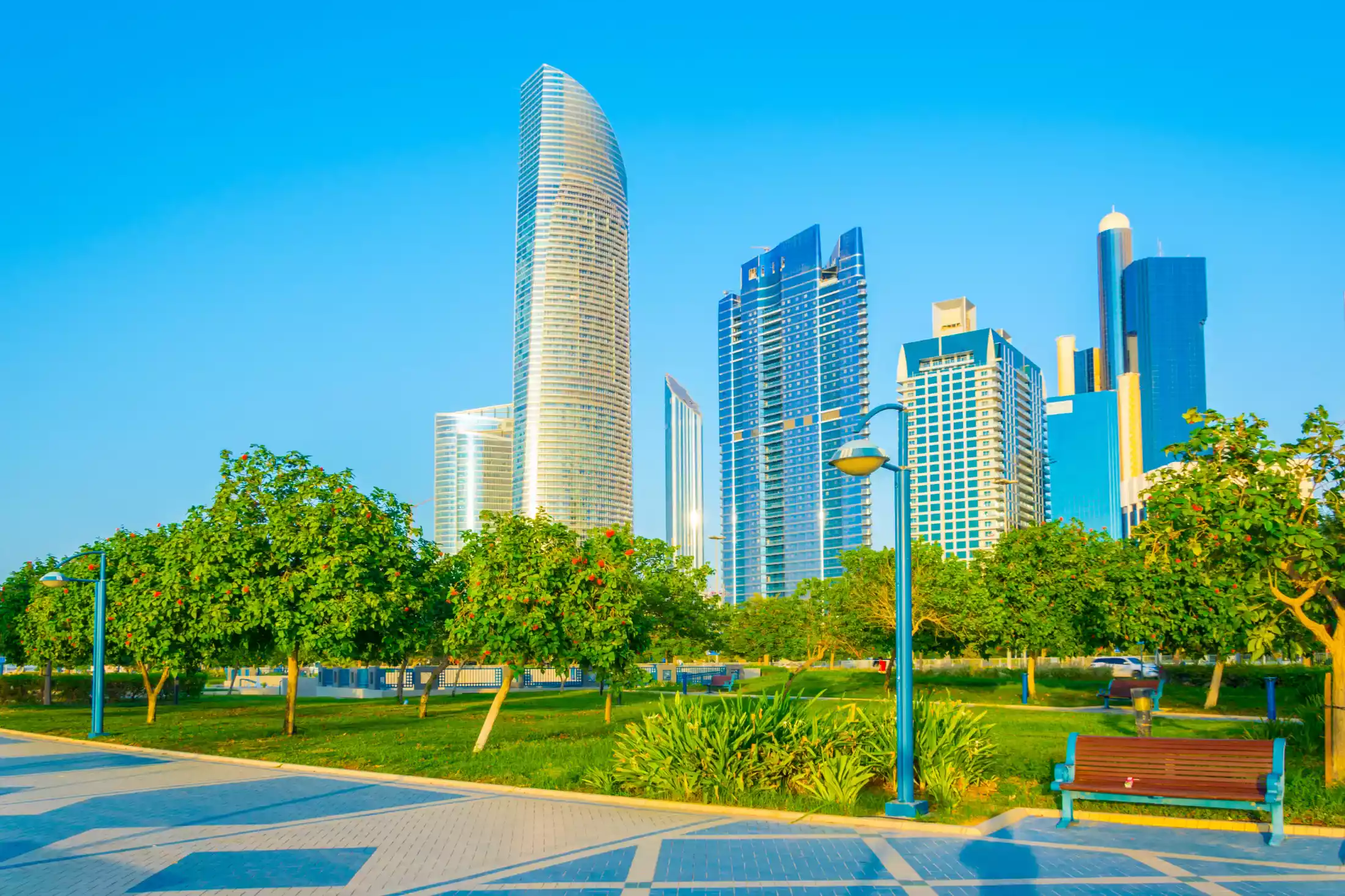 Trees and greenery along a path along the Corniche Abu Dhabi.