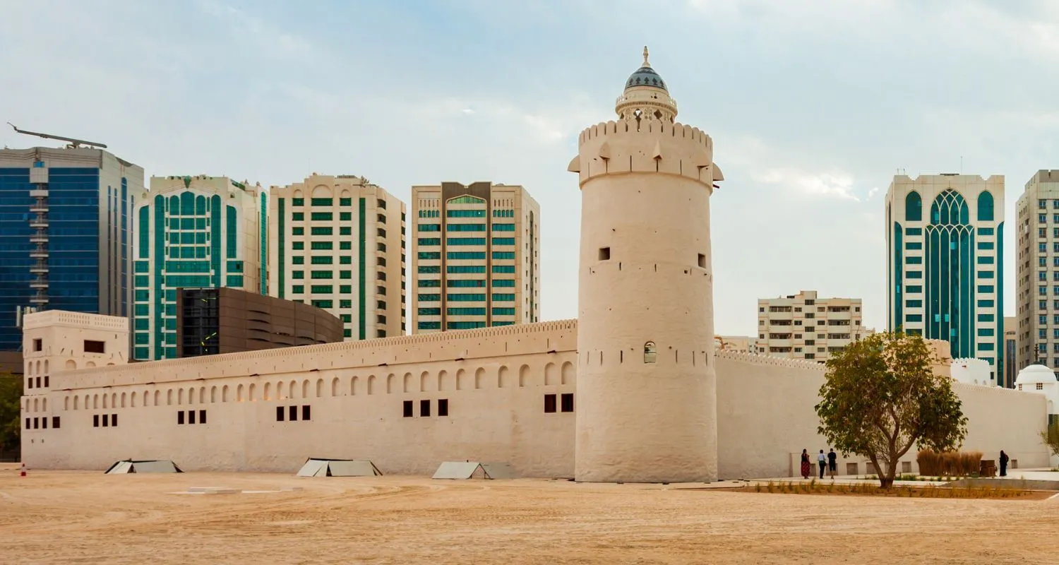 Ǫasr Al Hosn historic fort standing among modern city buildings, one of the most important Abu Dhabi attractions